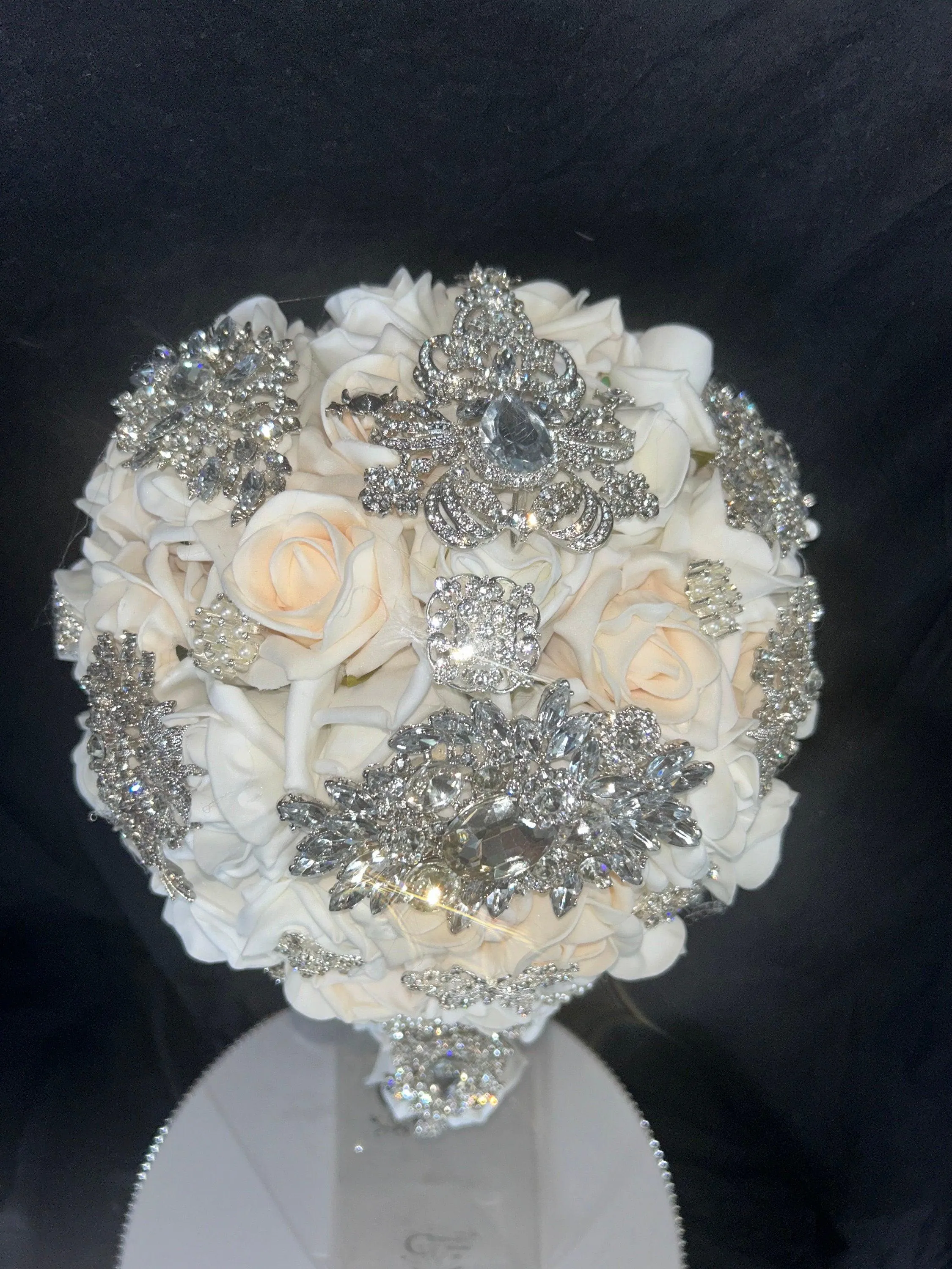 Navy brooch bouquet with artifical foam roses by Crystal wedding uk