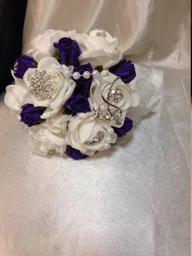 Navy brooch bouquet with artifical foam roses by Crystal wedding uk