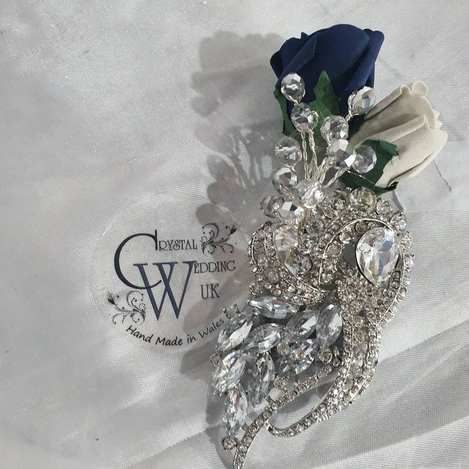 Navy brooch bouquet with artifical foam roses by Crystal wedding uk