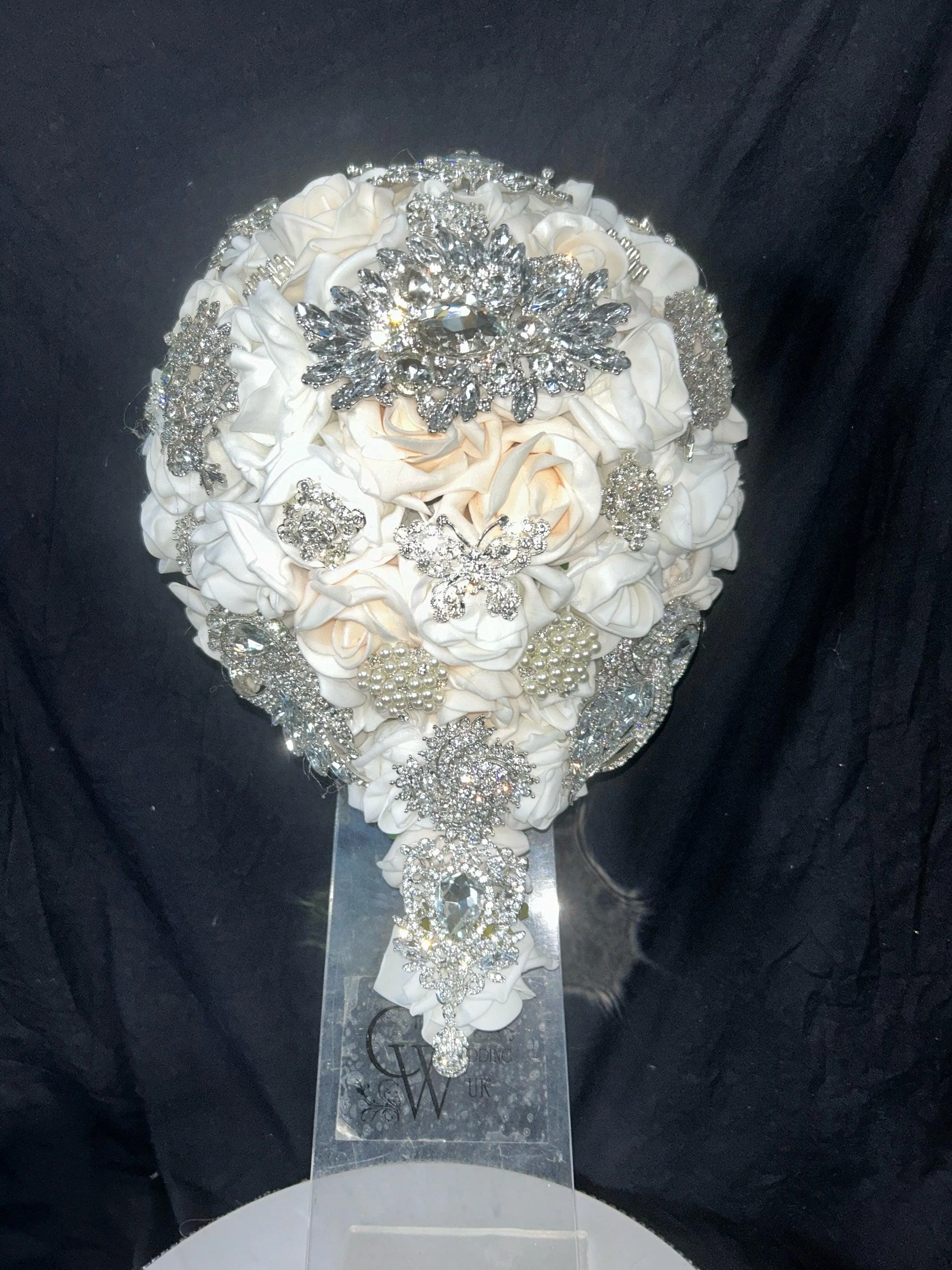 Navy brooch bouquet with artifical foam roses by Crystal wedding uk