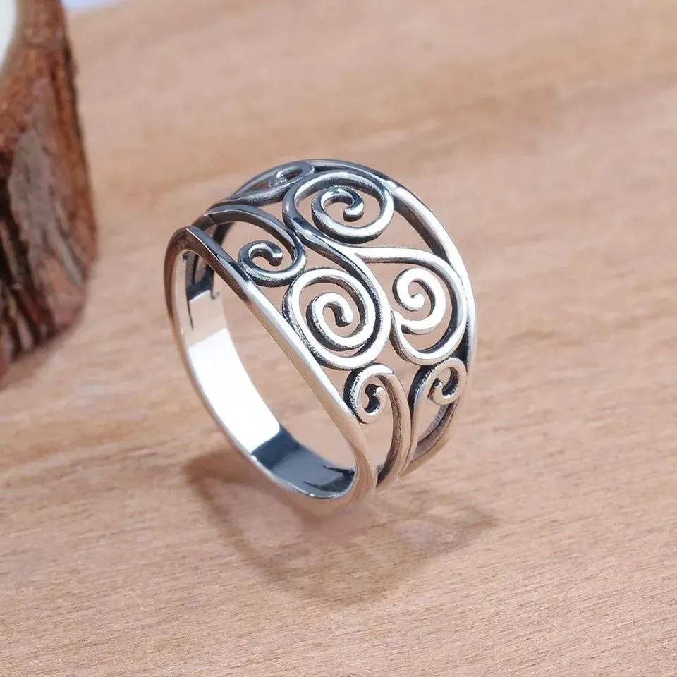 Silver Celtic ring with curling vine design