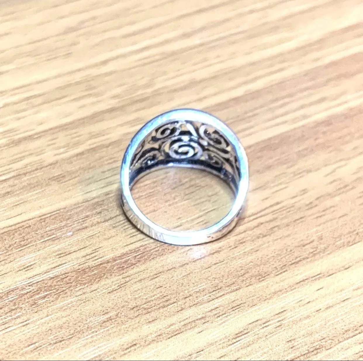 Silver Celtic ring with curling vine design